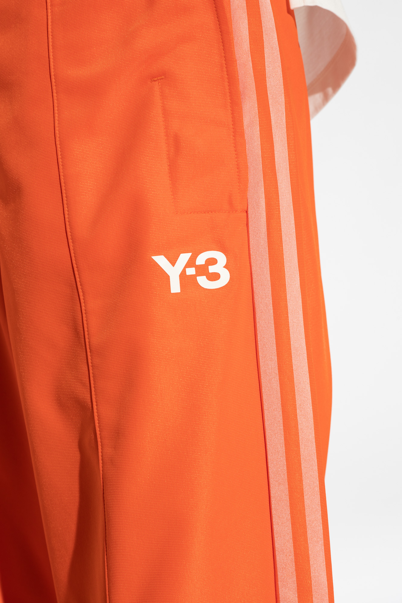 Orange on sale track pants